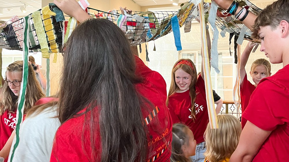 An image of an activity of volunteers and children